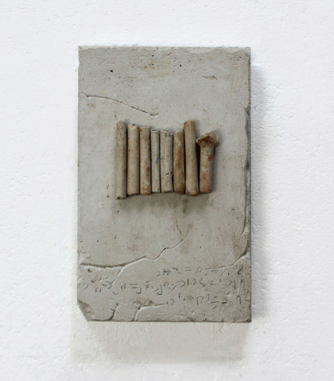 Clay Remnants, clay pipes on plaster, 15 x 10 cm