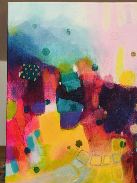 detail of Surya Namaskar, vibrant 100 × 100 cm abstract painting by Krisztina Megyeri, featuring luminous yellow, pink, green, turquoise and deep indigo.