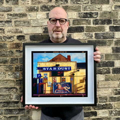 Richard holding Pleasure Park Landscape 445 Black Frame