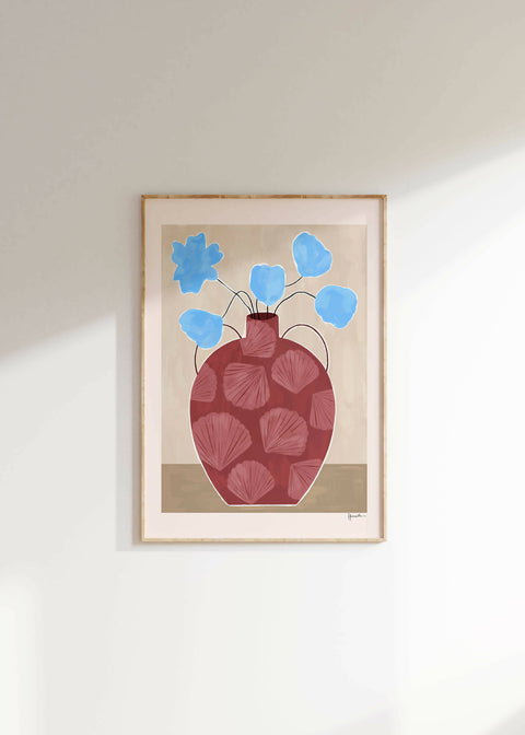 blue flowers in shell vase