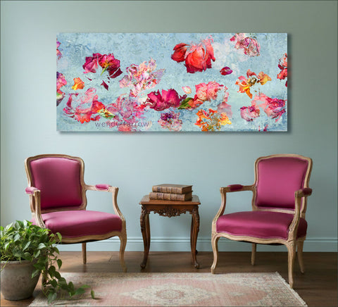 red and orange roses against a light blue background in an impressionistic style - floral wall art by wendy farrow in a room setting