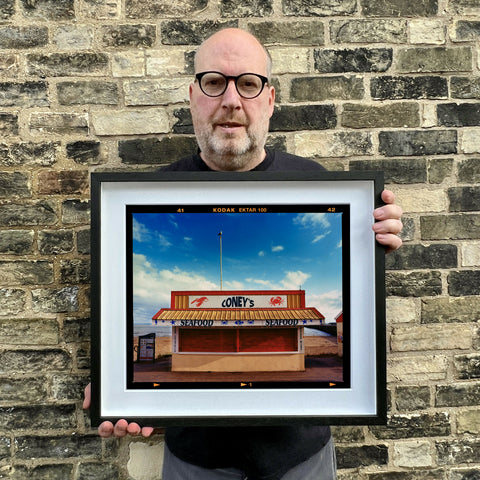 Richard holding Coney's Landscape 445 Black Frame