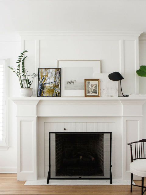 through the fields small painting on top a fireplace