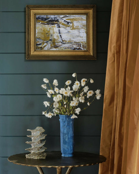 through the fields small painting on a dark wall