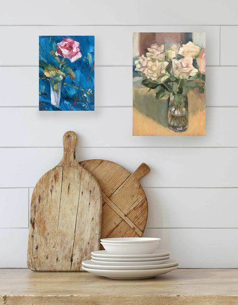 Floral oil paintings by British artist Sheri Gee, on kitchen wall